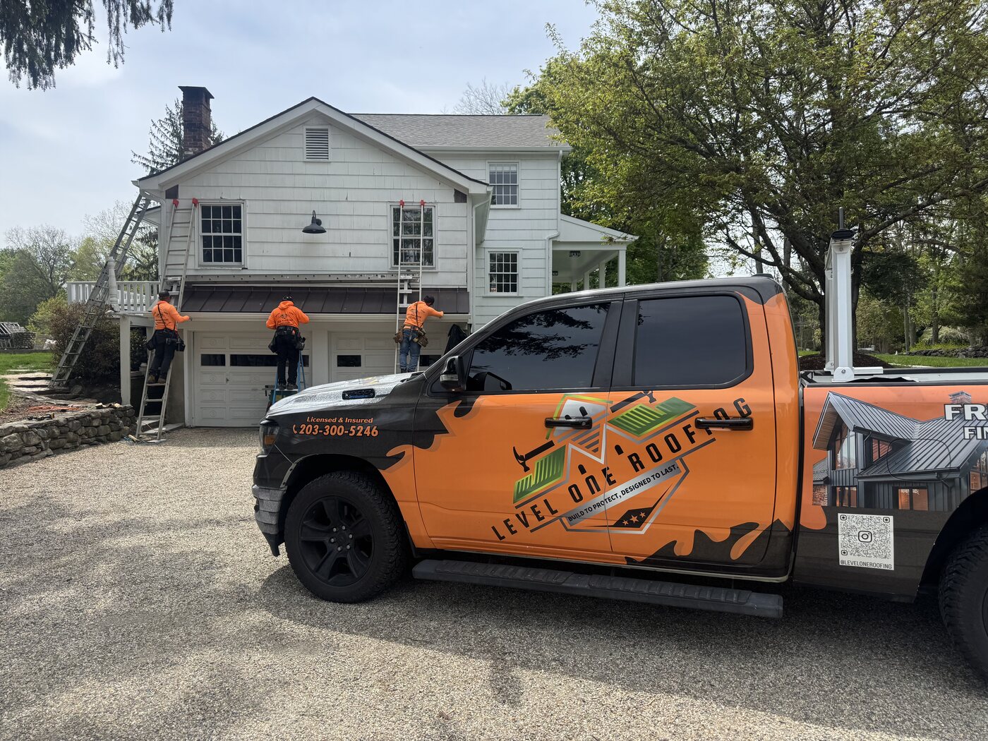 Level One Roofing branded truck on a Connecticut job site